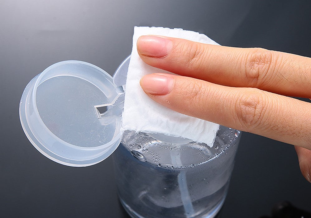 Disposable cotton pad to remove nail polish