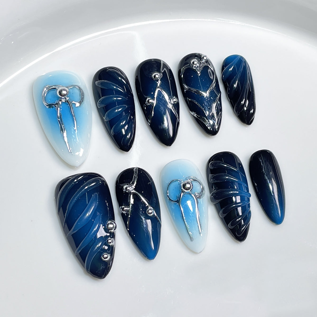 Sweet Edgy And Sassy Hand-painted Embossed Blush Nails For A Bold Eye-catching Look